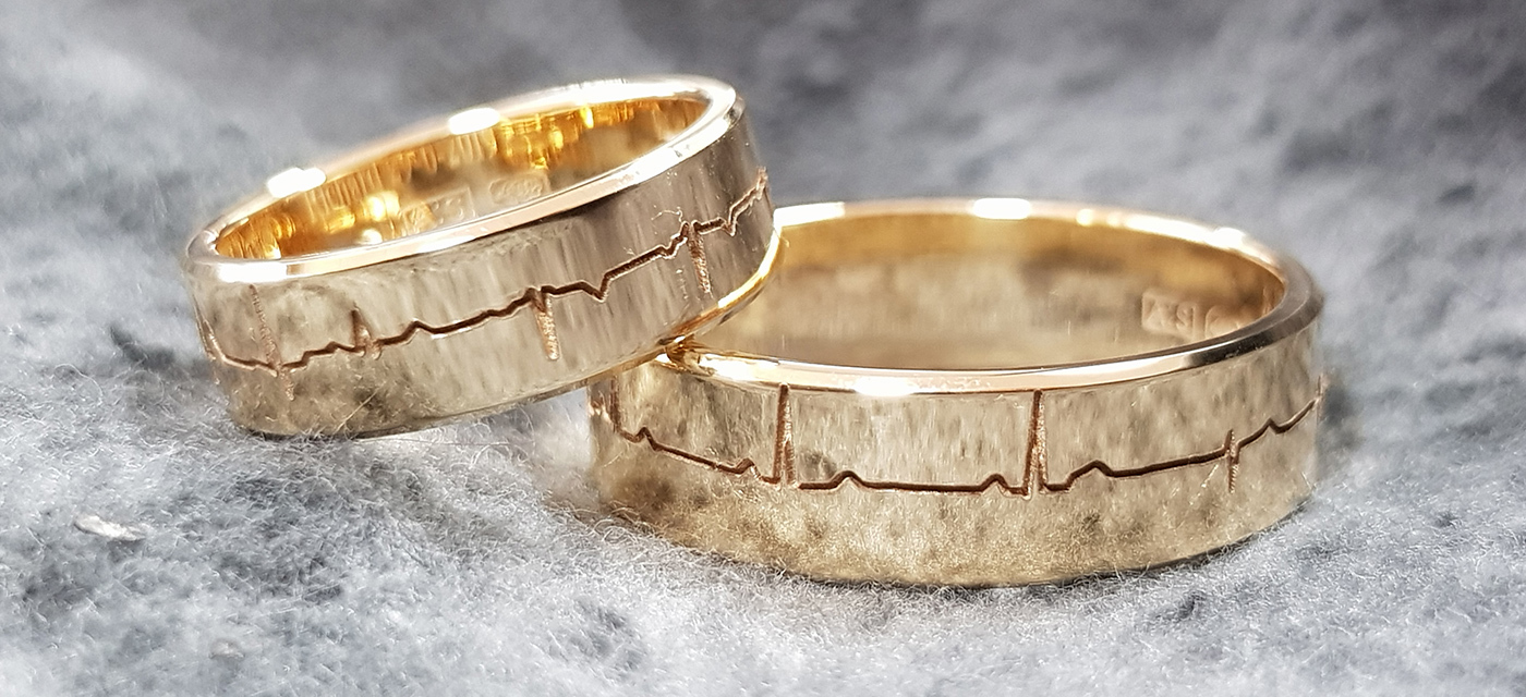 Geelgouden ringen met hartslag